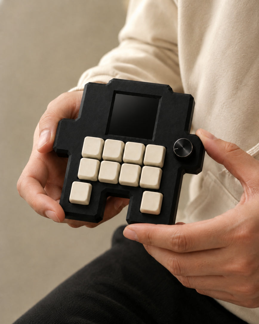 Codogotchi Midnight device held in two hands